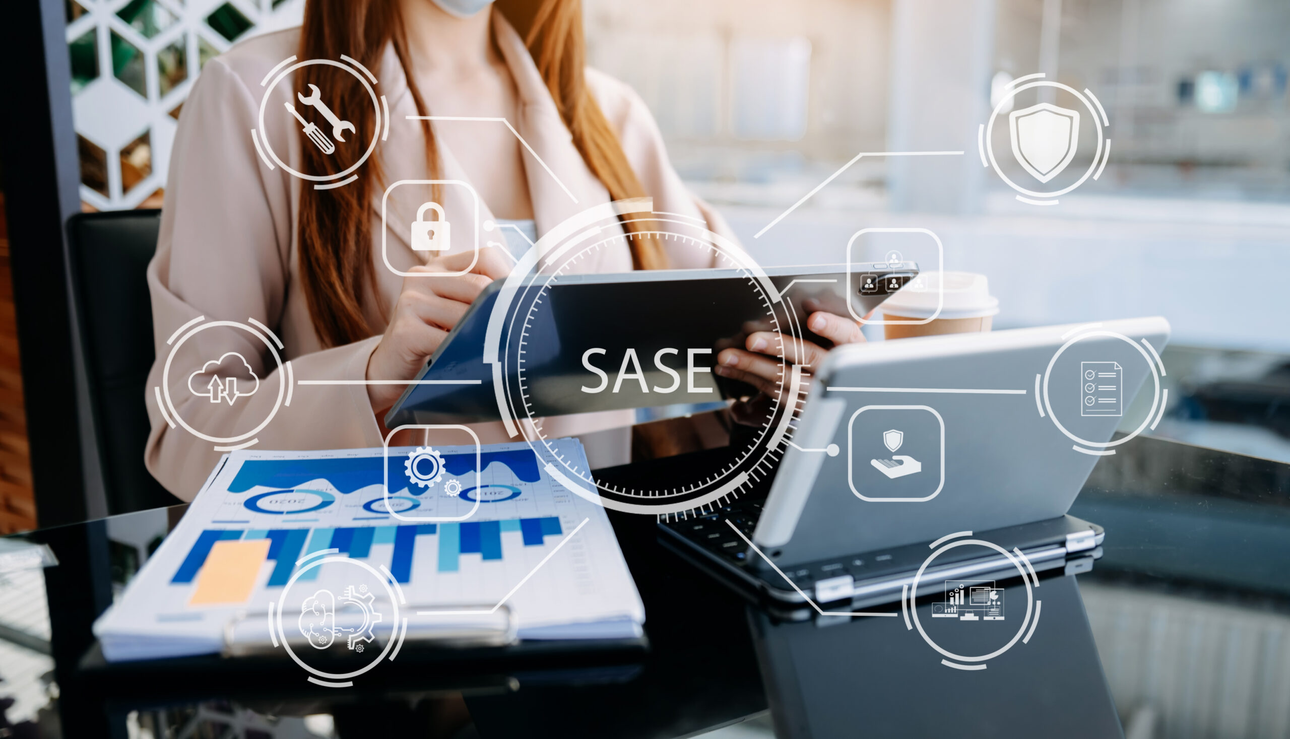 Person writing on a tablet with the word SASE in front of it. 